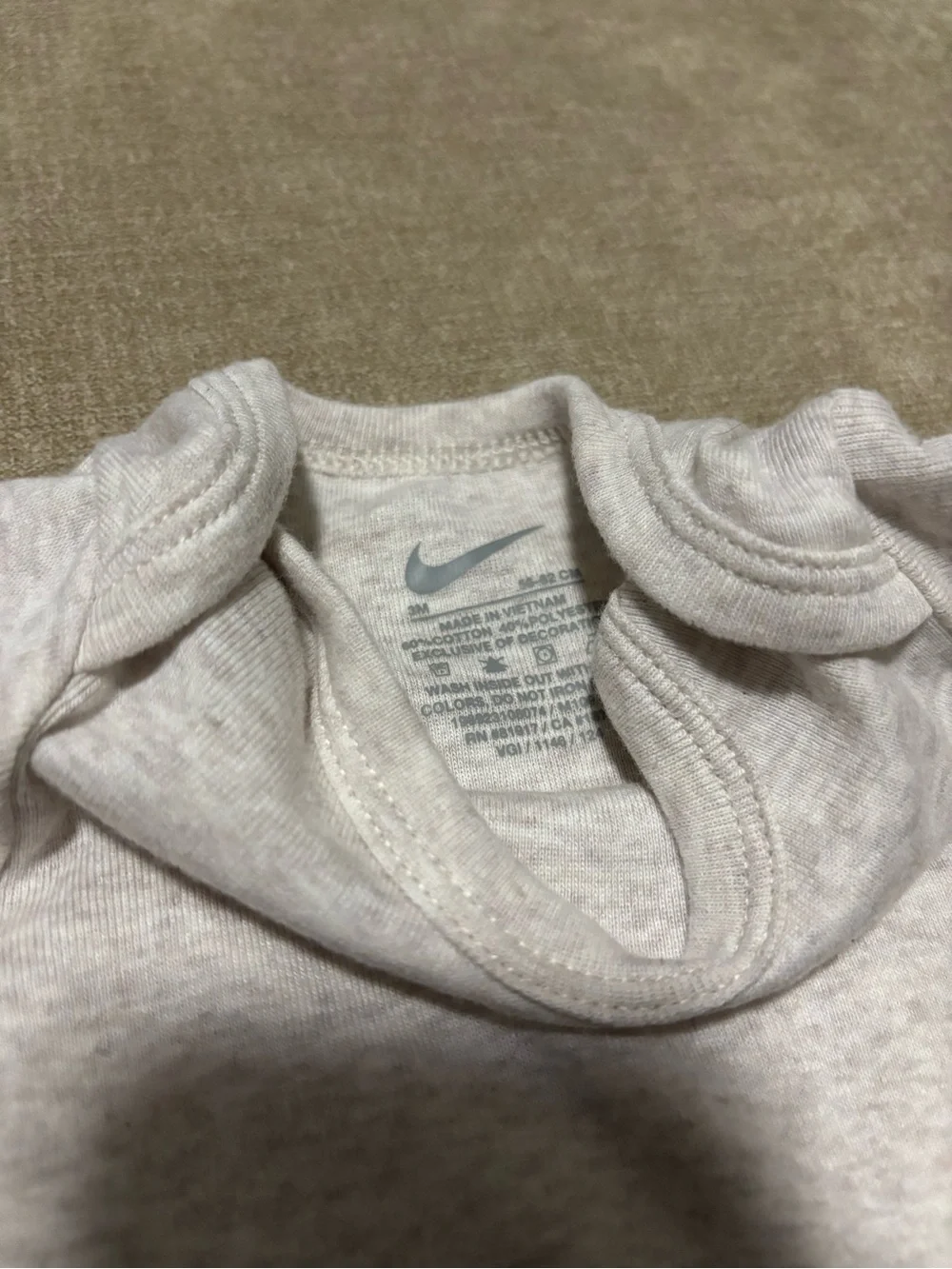Nike Infant Short-Sleeve One-Piece Bodysuit in Heather Gray with Tan Swoosh